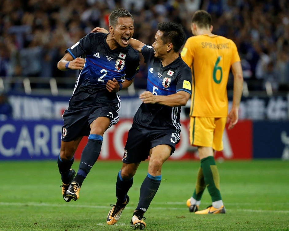 Japan’s Ideguchi Yosuke, left, celebrates his goal with teammate Yuto Nagatomo, August 31, 2017. (REUTERS)