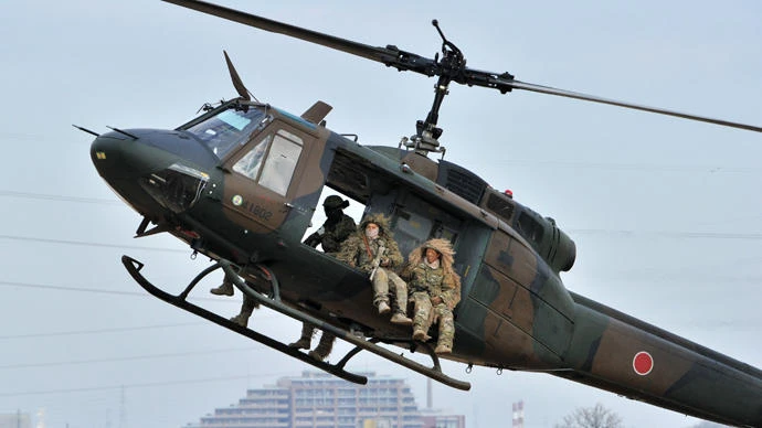 Members of Japanese Ground Self Defense Forces on a UH-1 helicopter during the new year exercise in Narashino, Chiba prefecture, Japan, on January 12, 2014 (File photo by AFP)