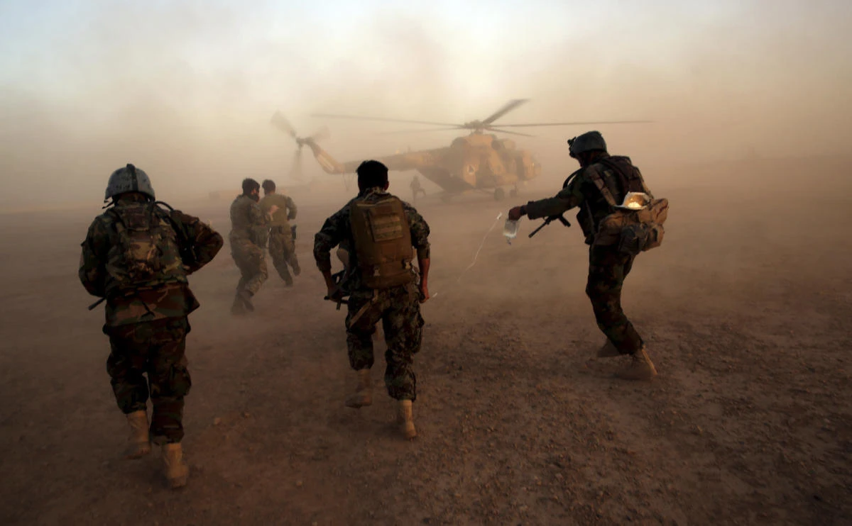 In this Aug. 27, 2017 file photo, Afghan army commandos train at the Shorab military camp in Helmand province, Afghanistan. Despite seemingly stalemated peace talks between Afghanistan's government and the Taliban, officials familiar with the efforts say the country's intelligence chief has exchanges by telephone nearly every day with leaders of the militant group. (AP)