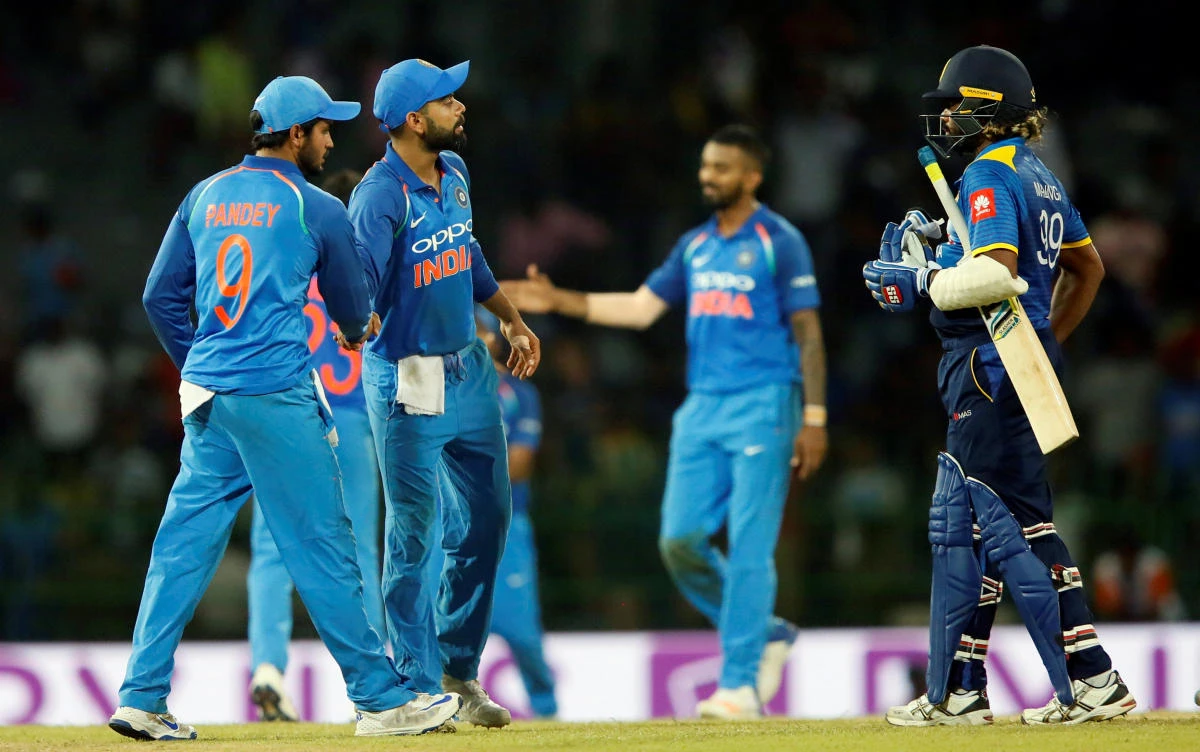 India’s team captain Virat Kohli celebrates with his teammates next to team captain Lasith Malinga of Sri Lanka after winning the match against Sri Lanka. (REUTERS)