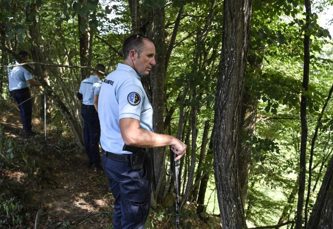 French gendarmes search for evidences on August 29, 2017 in the area around Pont-de-Beauvoisin, eastern france, after Maelys, a 9-year-old girl, disappeared during a wedding party two days ago. The girl has not been seen since around 3:00 am on August 27 when she was at the wedding with her parents in the town of Pont-de-Beauvoisin in the French Alps near the town of Chambery. Around 100 police including divers as well as cavers and dog handlers have been searching for the girl. (AFP)