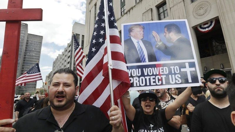 Iraqis and supporters rallied outside a Detroit courthouse Wednesday as a hearing began on a lawsuit that seeks to stop the government from deporting more than 100 Iraqi nationals who were recently rounded up. (AP)