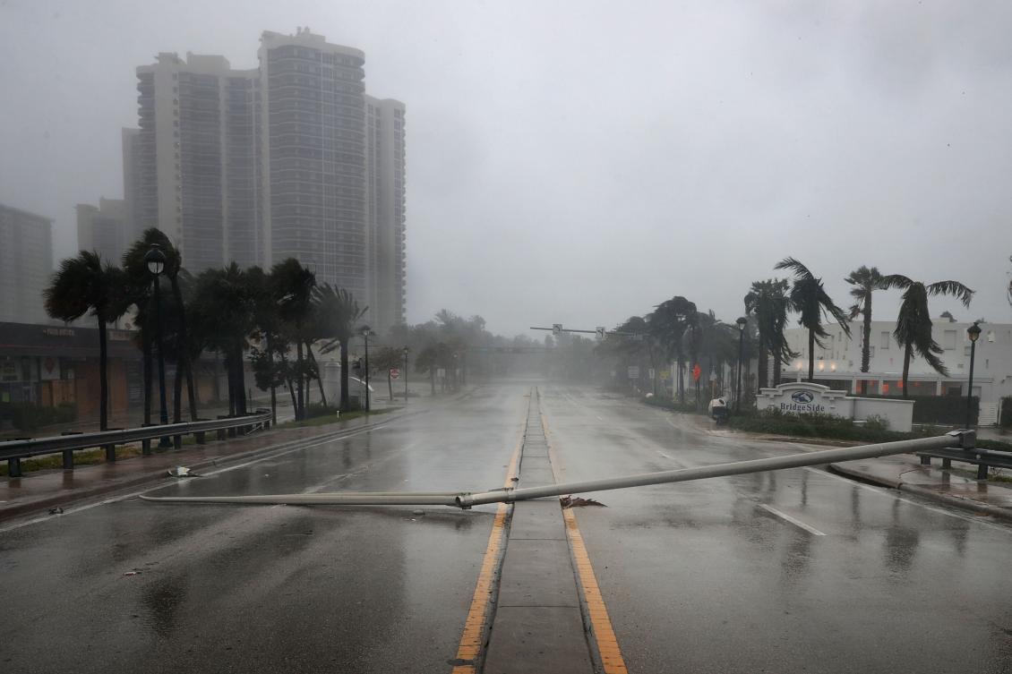 FORT LAUDERDALE, FL - SEPTEMBER 10: East Oakland Park Boulevard is completely blocked by a downed street light pole as Hurricane Irma hits the southern part of the state September 10, 2017 in Fort Lauderdale, Florida. The powerful hurricane made landfall in the United States in the Florida Keys at 9:10 a.m. after raking across the north coast of Cuba. Chip Somodevilla/Getty Images/AFP == FOR NEWSPAPERS, INTERNET, TELCOS & TELEVISION USE ONLY ==