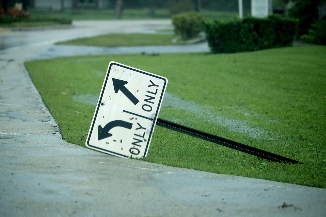 FORT LAUDERDALE, FL - SEPTEMBER 10: A street sign is knocked over by high winds in the Coral Beach neighborhood as Hurricane Irma hits the southern part of the state September 10, 2017 in Fort Lauderdale, Florida. The powerful hurricane made landfall in the United States in the Florida Keys at 9:10 a.m. after raking across the north coast of Cuba. Chip Somodevilla/Getty Images/AFP == FOR NEWSPAPERS, INTERNET, TELCOS & TELEVISION USE ONLY ==