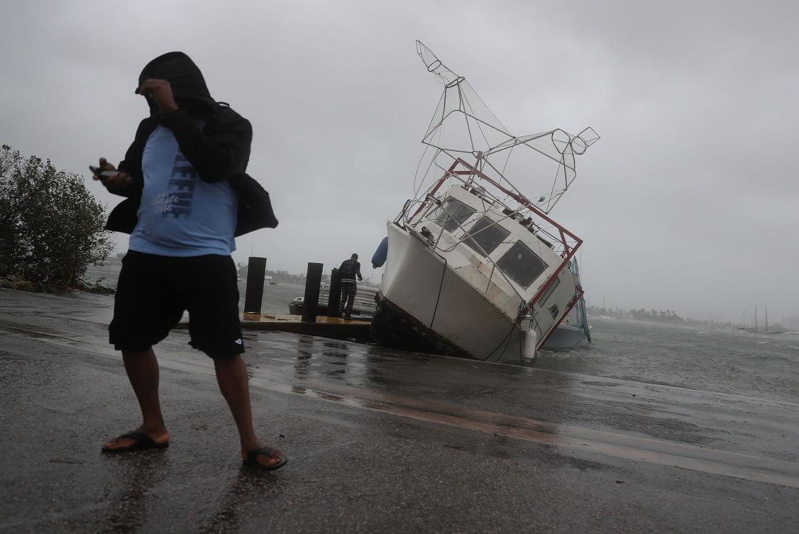 MIAMI, FL - SEPTEMBER 10: A boat is washed on shore at the Watson Island marina as Hurricane Irma passed through the area on September 10, 2017 in Miami, Florida. Hurricane Irma, which first made landfall in the Florida Keys as a Category 4 storm on Sunday, has weakened to a Category 2 as it moves up the coast. Joe Raedle/Getty Images/AFP == FOR NEWSPAPERS, INTERNET, TELCOS & TELEVISION USE ONLY ==