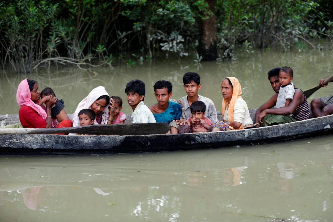 Rohingya refugees arrive in Bangladesh after crossing border by boat through the Naf River in Teknaf, Bangladesh, September 7, 2017. REUTERS/Mohammad Ponir Hossain