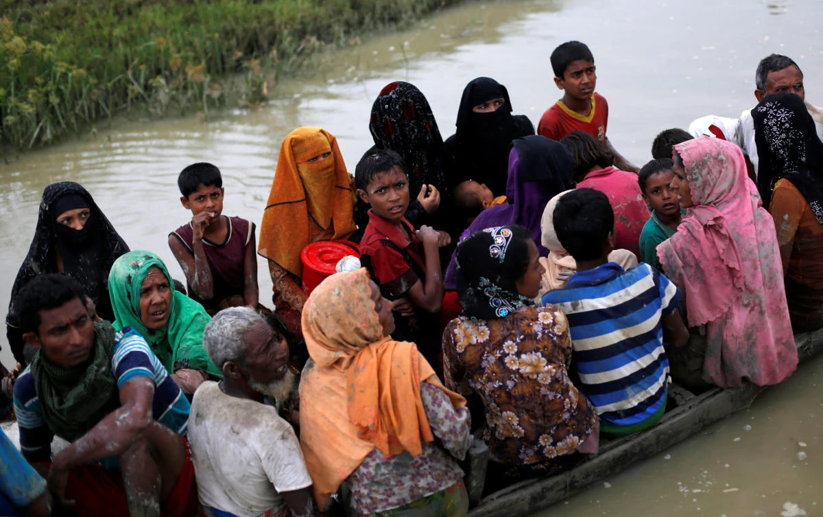 Rohingya ride a boat after crossing the Bangladesh-Myanmar border, in Teknaf, Bangladesh, September 6, 2017. REUTERS/Danish Siddiqui