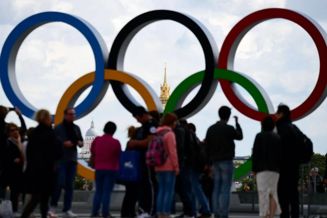 A picture taken on September 14, 2017 shows the Olympics Rings on the Trocadero Esplanade near the Eiffel Tower in Paris, after the International Olympic Committee named Paris host city of the 2024 Summer Olympic Games. The International Olympic Committee named Paris and Los Angeles as hosts for the 2024 and 2028 Olympics on September 13, 2017, crowning two cities at the same time in a historic first for the embattled sports body. / AFP / FRANCK FIFE
