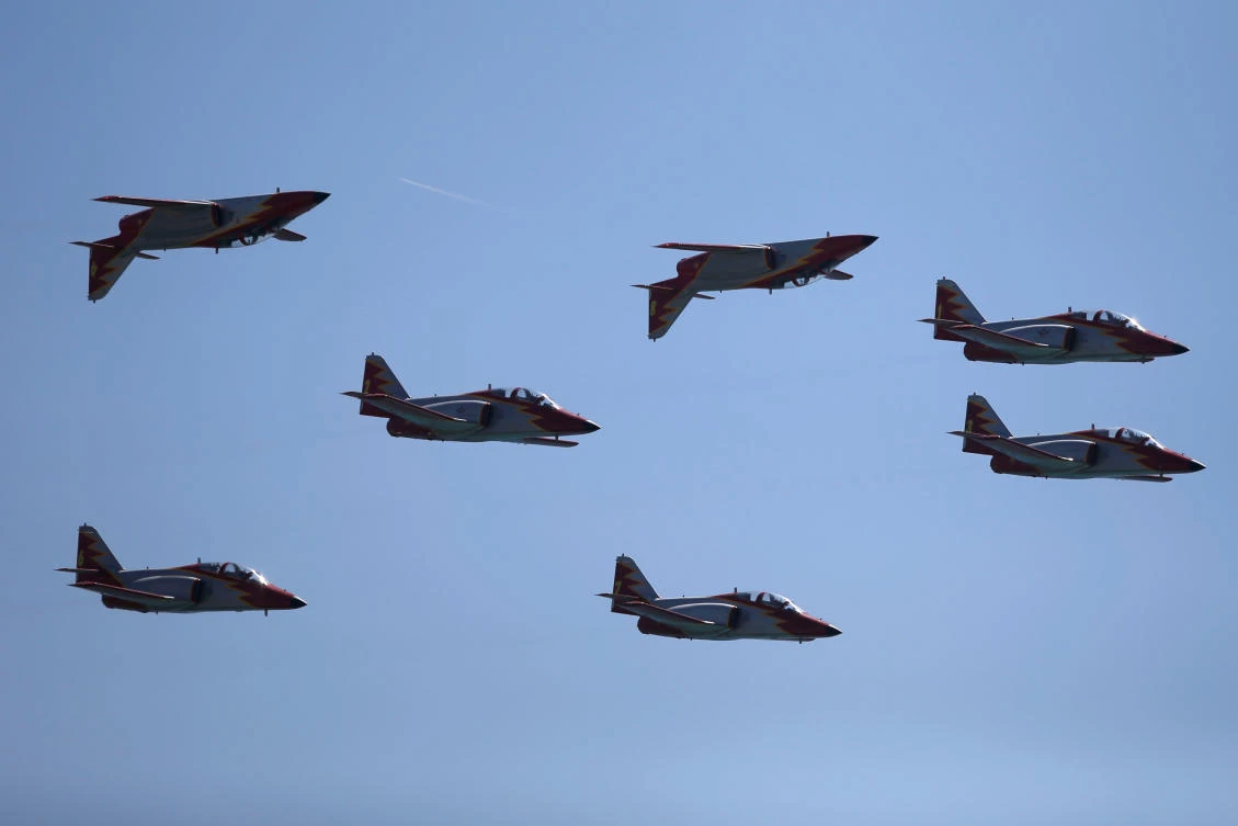 Casa C-101 Aviojets from the Spanish Air Force aerobatic group Patrulla Aguila (Eagle Patrol) fly during an international aerial and naval military exhibition commemorating the centennial of the Spanish Naval Aviation, over a beach near the naval airbase in Rota, southern Spain, September 16, 2017. REUTERS/Jon Nazca