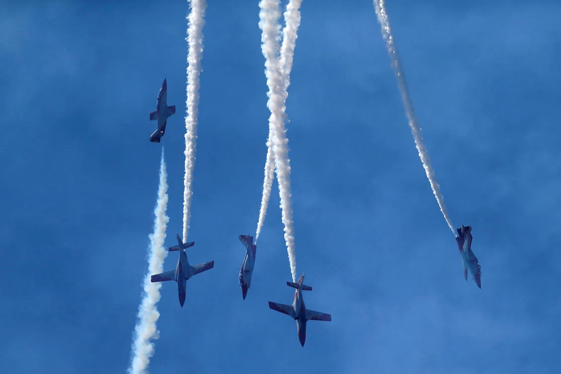 Casa C-101 Aviojets from the Spanish Air Force aerobatic group Patrulla Aguila (Eagle Patrol) fly during an international aerial and naval military exhibition commemorating the centennial of the Spanish Naval Aviation, over a beach near the naval airbase in Rota, southern Spain, September 16, 2017. REUTERS/Jon Nazca