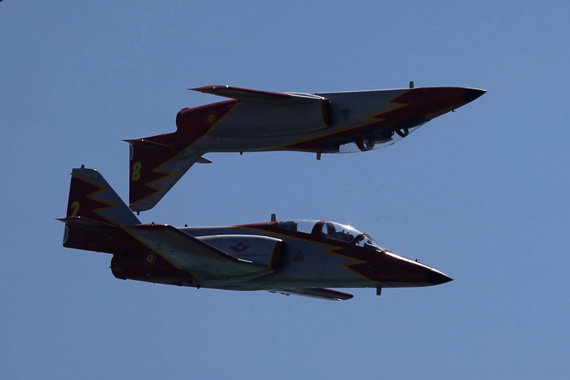 Casa C-101 Aviojets from the Spanish Air Force aerobatic group Patrulla Aguila (Eagle Patrol) fly during an international aerial and naval military exhibition commemorating the centennial of the Spanish Naval Aviation, over a beach near the naval airbase in Rota, southern Spain, September 16, 2017. REUTERS/Jon Nazca