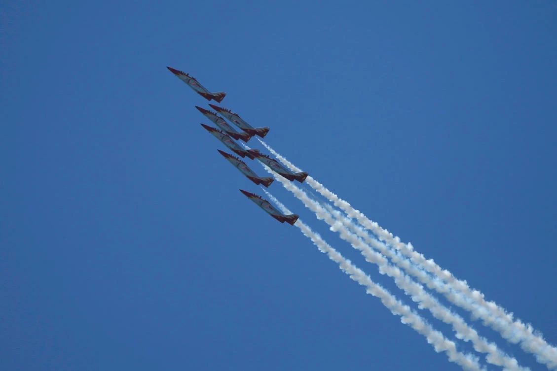 Casa C-101 Aviojets from the Spanish Air Force aerobatic group Patrulla Aguila (Eagle Patrol) fly during an international aerial and naval military exhibition commemorating the centennial of the Spanish Naval Aviation, over a beach near the naval airbase in Rota, southern Spain, September 16, 2017. REUTERS/Jon Nazca