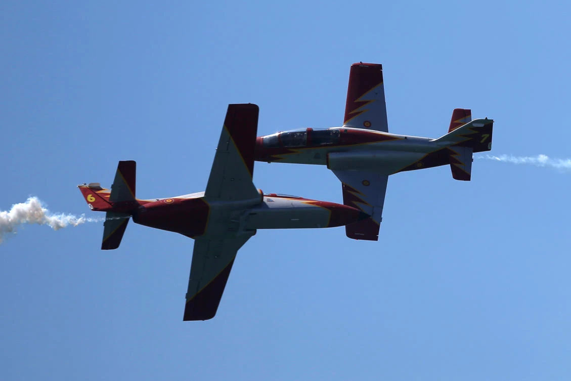 Casa C-101 Aviojets from the Spanish Air Force aerobatic group Patrulla Aguila (Eagle Patrol) fly during an international aerial and naval military exhibition commemorating the centennial of the Spanish Naval Aviation, over a beach near the naval airbase in Rota, southern Spain, September 16, 2017. REUTERS/Jon Nazca