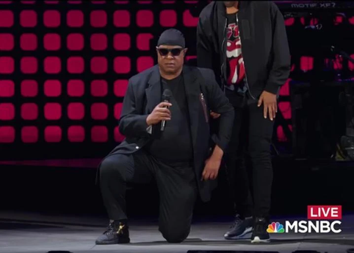 Stevie Wonder is seen taking a knee at the 2017 Global Citizen Festival in Central Park. (Photo courtesy: social media)