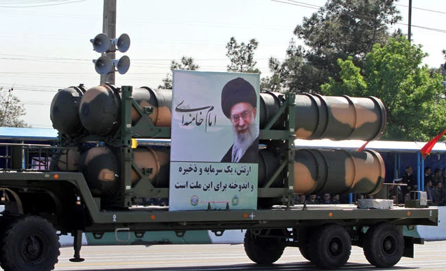 In this April 18, 2017 file photo, an Iranian military truck carries parts of the S-300 air defense missile system during a parade on the occasion of the country's Army Day in Tehran. Iran on Sunday put the S-300 air defense system on display for public viewing. (AFP / ATTA KENARE)