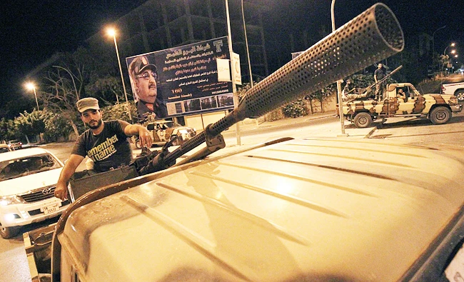 Members of the Libyan Special Forces, loyal to the country's east strongman Khalifa Haftar, patrol the streets in the eastern city of Benghazi, in this September 19, 2017 photo, in a bid to assist local security forces in their mission. (AFP)