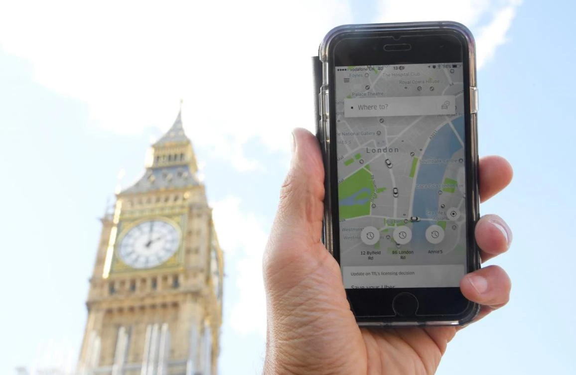 A photo illustration shows the Uber app on a mobile telephone, as it is held up for a posed photograph in central London, Britain September 22, 2017. (REUTERS)