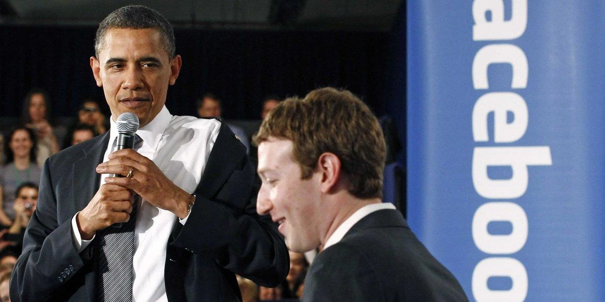 US President Barack Obama takes off his jacket as he attends a town hall meeting at Facebook headquarters with CEO Mark Zuckerberg in Palo Alto on April 20, 2011. (File photo by Reuters)
