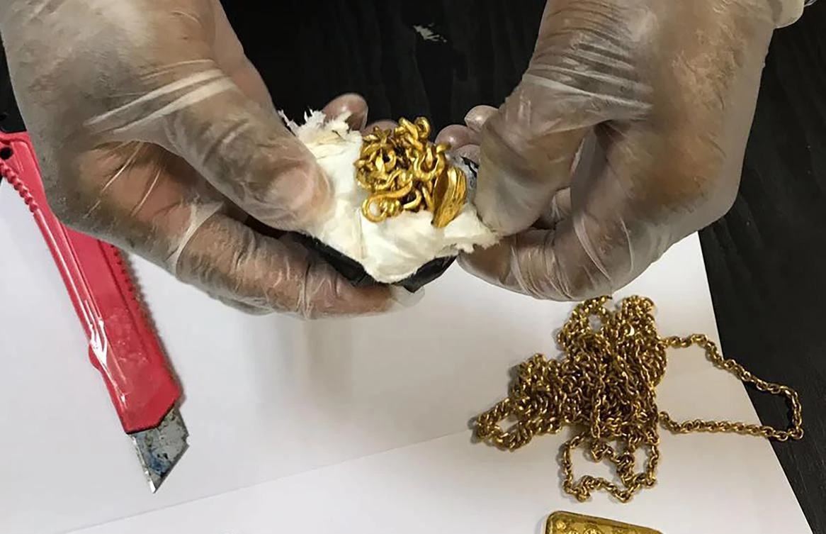 This handout photo released by the Sri Lanka Customs Office shows a Sri Lankan customs official displaying gold that had been found stuffed in a man’s rectum at the country’s main international airport in Colombo on September 25, 2017. (Sri Lanka Customs Office via AFP)