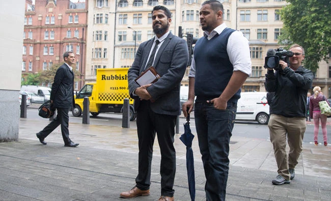 International director of campaign group Cage, Muhammad Rabbani (center left) arrives at Westminster Magistrates' Court in London on September 25, 2017, for his trial, after being accused of refusing to reveal his mobile phone password at Heathrow Airport last year. (AFP / Daniel Leal-Olivas)