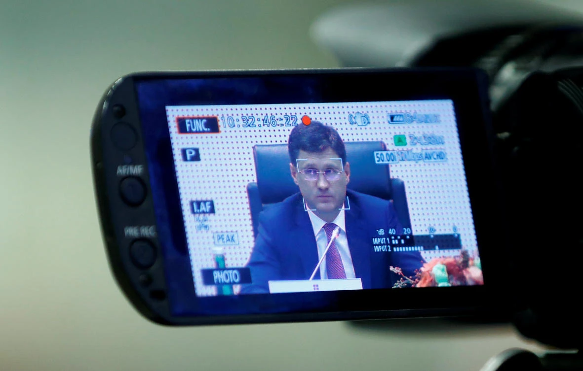 Russia's Energy Minister Novak is seen on a camera screen during a meeting of OPEC and non-OPEC countries in Vienna on Friday. (Reuters)