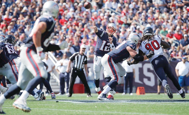 New England Patriots quarterback Tom Brady (12) throws a pass to tight end
Rob Gronkowski (87) against the Houston Texans in the second quarter at Gillette
Stadium on Sunday. (USA TODAY Sports)