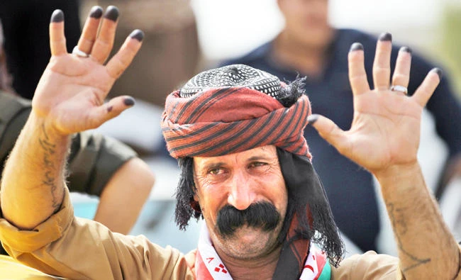 An Iraqi Kurdish man shows his ink-stained fingers after casting his vote in the Kurdish independence referendum in Kirkuk, northern Iraq, on Monday. (AFP)