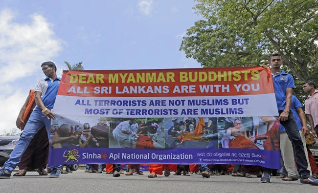 Sri Lankan Buddhists march in a rally in Colombo on Sept. 15, 2017 showing solidarity to Buddhists in Myanmar. (AP Photo/Eranga Jayawardena/ file photo)