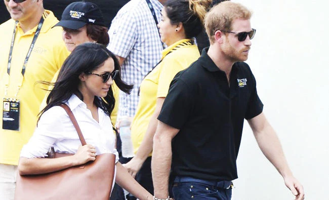 Prince Harry and his girlfriend Meghan Markle arrive at a wheelchair tennis event at the Invictus Games in Toronto. (AP)
