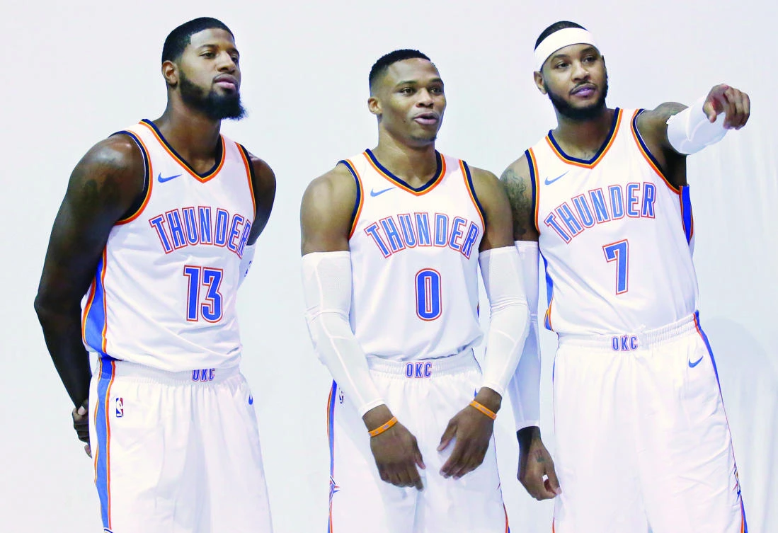 Oklahoma City Thunder’s Paul George (13), Russell Westbrook (0) and Carmelo Anthony (7) pose for photos during an NBA basketball media day in Oklahoma City on Monday. (AP)