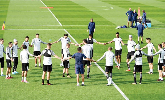 PSG players attend a training session on the eve of the UEFA Champions League football match PSG vs Bayern Munich on Tuesday at the Camp des Loges training center in Saint Germain-en-Laye, west of Paris. (AFP)