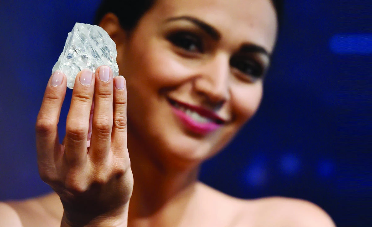 A model poses with the uncut 1109-carat diamond, the Lesedi La Rona, at Sotheby’s auction house in London. Graff bought the Lesedi La Rona diamond on Sept. 26 for $53 million from the Canadian mining company Lucara Diamond. (AFP)