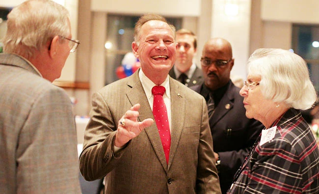 Republican candidate Roy Moore greets supporters at the RSA Activity center in Montgomery, Alabama, U.S. on Tuesday, during the runoff election for the Republican nomination for Alabama's U.S. Senate seat vacated by Attorney General Jeff Sessions. (REUTERS)