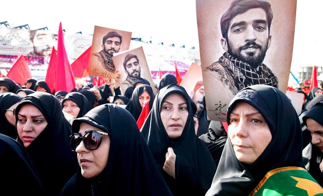 Iranians attend the state funeral of Mohsen Hojaji. (AP)