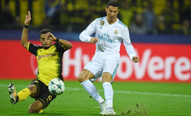 Real Madrid's forward from Portugal Cristiano Ronaldo scores during the UEFA Champions League Group H football match BVB Borussia Dortmund vs. Real Madrid in Dortmund, western Germany, on Tuesday. (AFP)