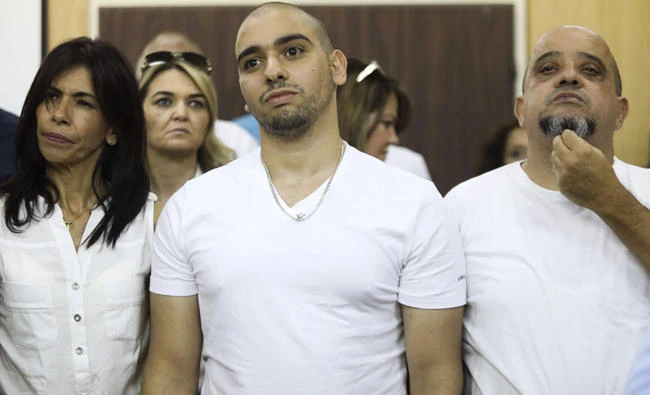 Israel cuts jail term of soldier who killed wounded assailant