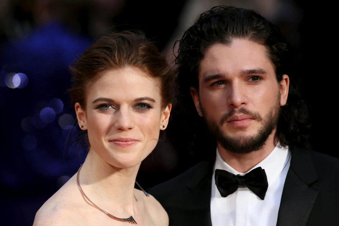 Actor Kit Harington (R) and actress Rose Leslie (L) pose for photographers as they arrive at the Olivier Awards at the Royal Opera House in London, Britain April 3, 2016. (REUTERS)