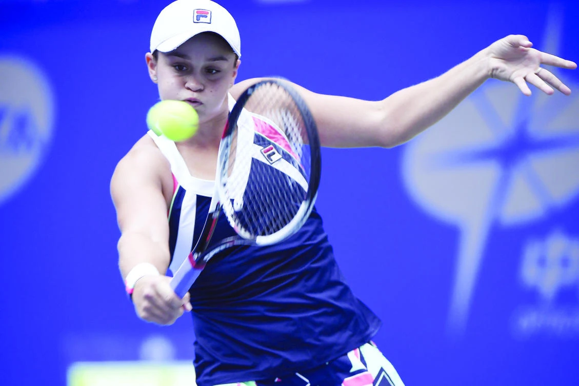 Ashleigh Barty of Australia hits a return against Karolina Pliskova of Czech Republic during the women’s singles quarterfinal match at the WTA Wuhan Open tennis tournament in Wuhan, China, on Thursday. (AFP)