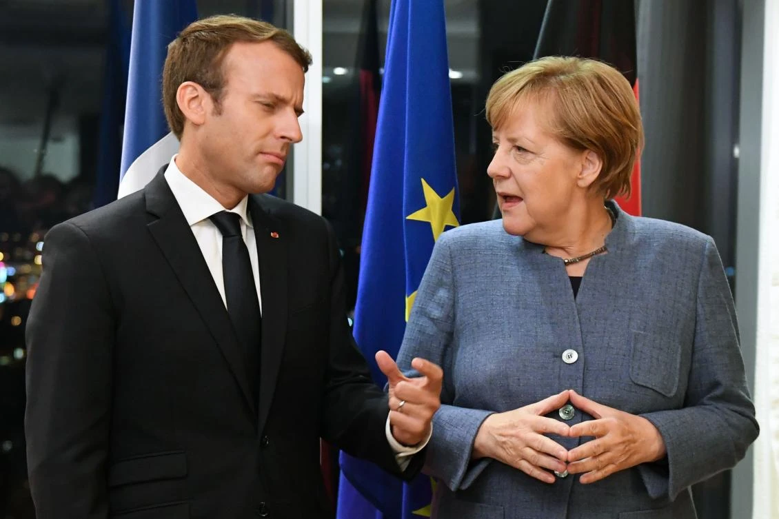 France's President Emmanuel Macron (L) and Germany's Chancellor Angela Merkel. (ALTERNATIVE CROP / AFP)