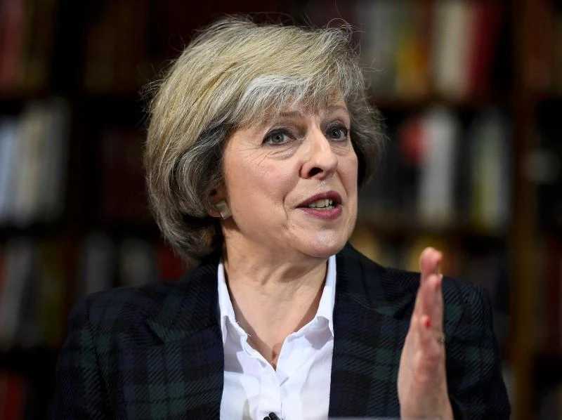 British Prime Minister Theresa May cited the need to come together in the face of threats from Russia. (Reuters)