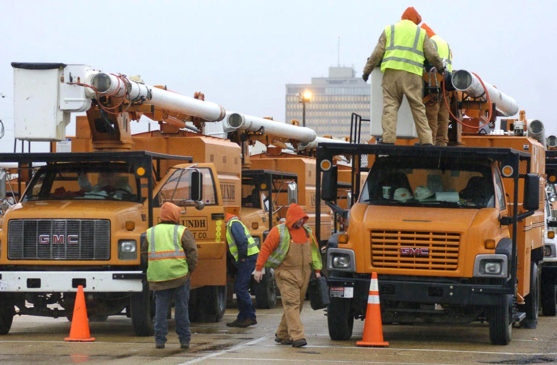Asplundh Tree Expert employees prepare equipment for a winter storm at a staging area on the Mississippi State Fairgrounds in this 2011 photo. (Greg Jenson/The Clarion-Ledger via AP)