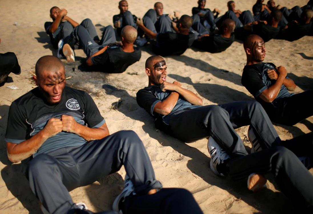 Palestinian policemen take part in military training at a Hamas-run police academy in Khan Younis in the southern Gaza Strip on Wednesday. (Reuters)
