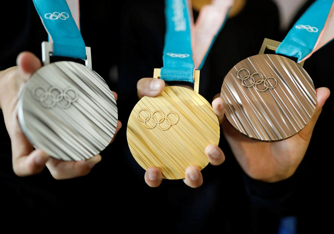 Above, medals for the Pyeongchang 2018 Winter Olympic Games on display during the unveiling ceremony in Seoul, South Korea on September 21. (Reuters)