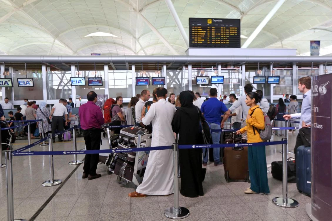 Above, passengers at Irbil airport on September 28 as they rush to beat the Friday suspension of all foreign flights to and from the Iraqi Kurdish capital. (AFP)
