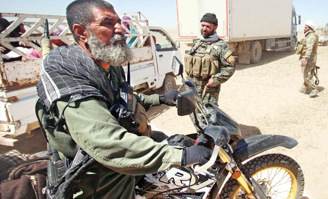 A picture taken on April 26 shows Iraqi Abu Tahsin Al-Salhi who boasted about killing at least 320 Daesh men during the fight for Mosul. (AFP)