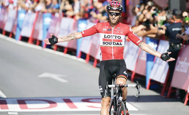 Lotto Soudal's Polish cyclist Tomasz Marczynski celebrates as he crosses the finish line of the 12th stage of La Vuelta Tour of Spain cycling race on Thursday. (AFP)