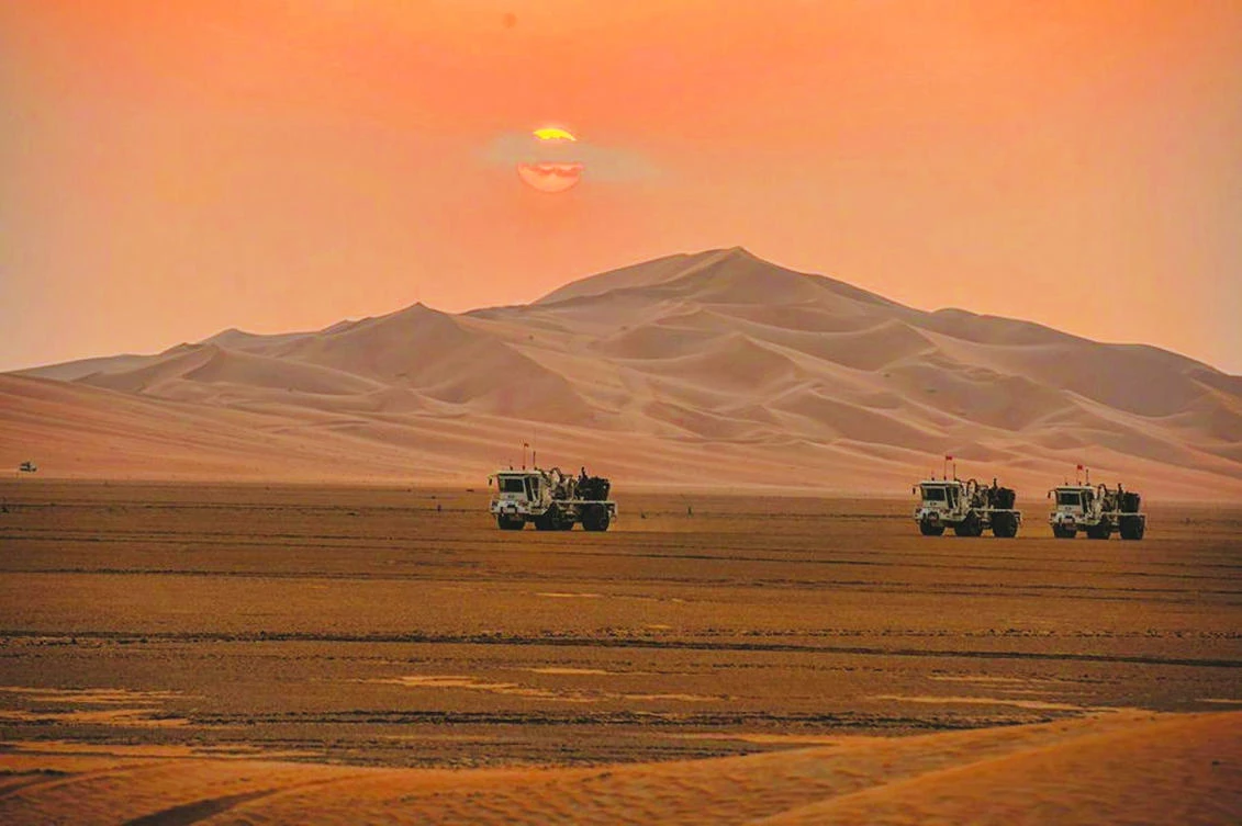 Saudi Aramco trucks are seen during exploration in the Empty Quarter on Nov. 18, 2013. (Saudi Aramco/Reuters)