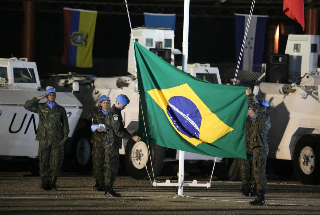 Brazilian peacekeepers lower a Brazilian flag at the closing ceremony of the end of the operations of the Brazilian battalion in Port-au-Prince, Haiti, on August 31, 2017. (File photo by Reuters)