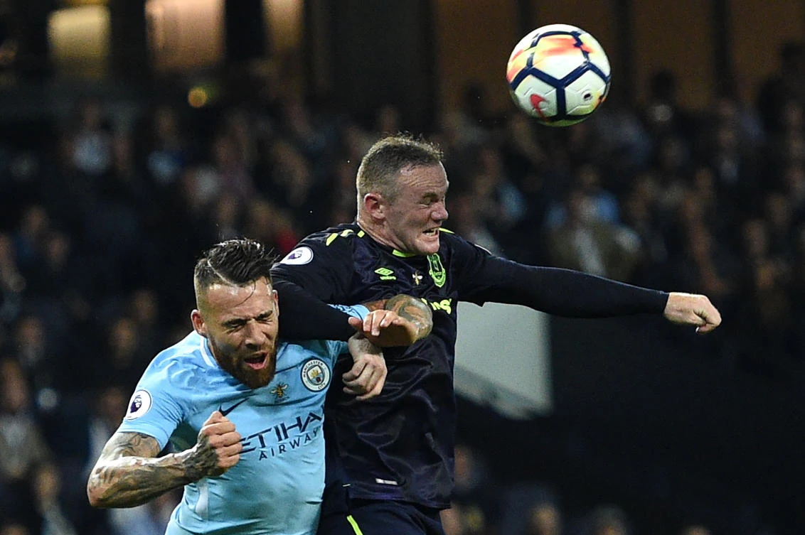 Manchester City’s Argentinian defender Nicolas Otamendi (L) vies with Everton’s English striker Wayne Rooney during the English Premier League football match between Manchester City and Everton at the Etihad Stadium in Manchester, north west England, on August 21, 2017. (AFP)