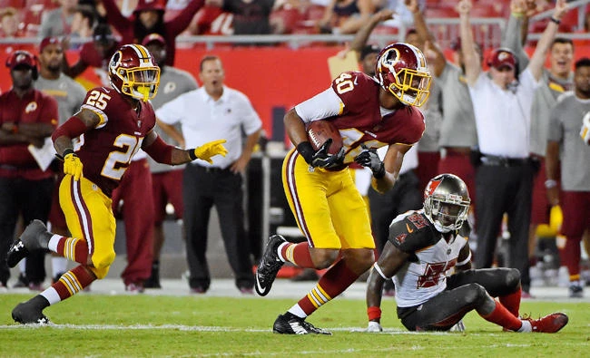 Washington Redskins linebacker Josh Harvey-Clemons (40) intercepts a pass and runs for a touchdown against the Tampa Bay Buccaneers at Raymond James Stadium Thursday. (USA TODAY Sports)